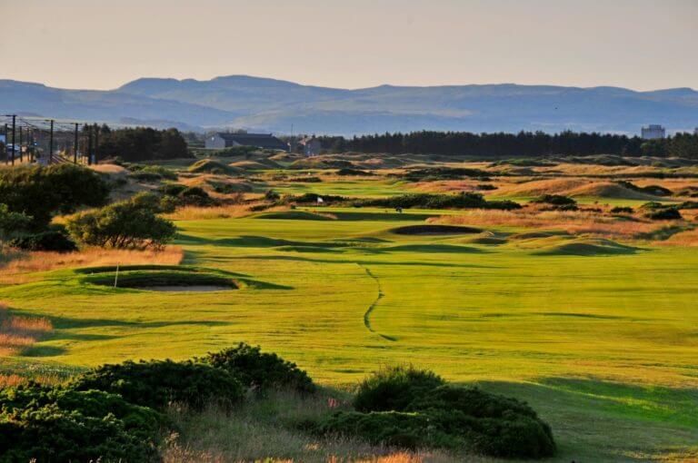Golden sunlight shines over Kilmarnock Barassie Links golf course