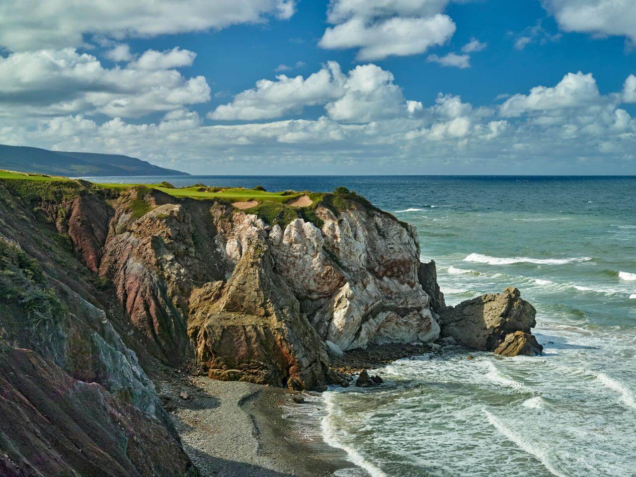 Towering cliffs separate golf course from ocean