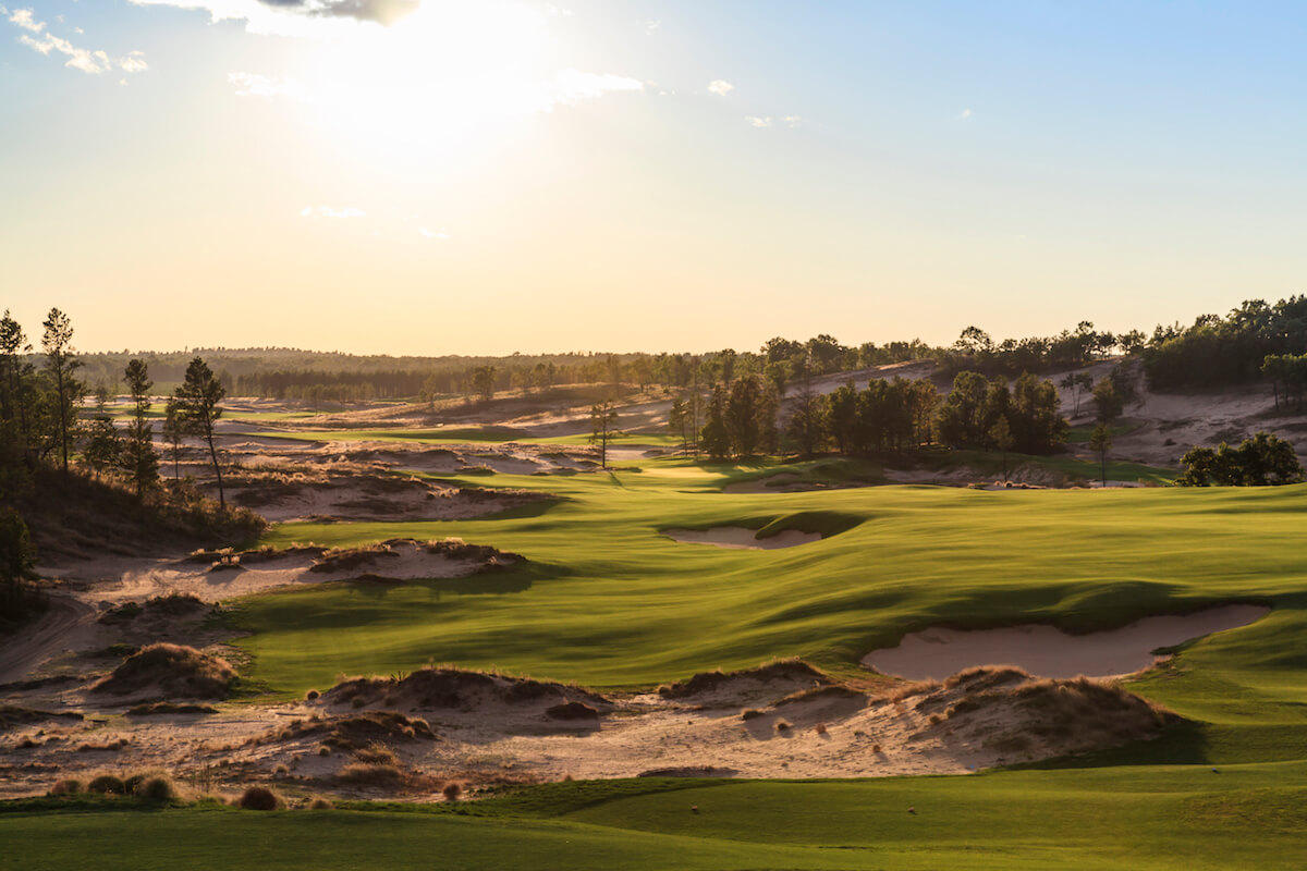 Setting sun over the tenth hole at Sand Valley golf course