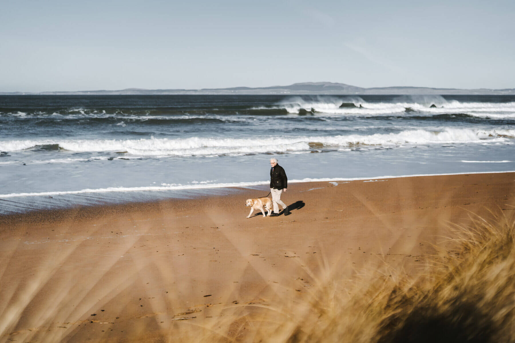 Walkers on the beach at The Machrie
