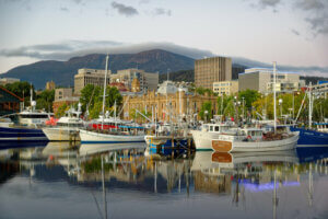 Fishing boats and yachts moored at Franklin Wharf in Hobart with Mount Wellington behind, Tasmania
