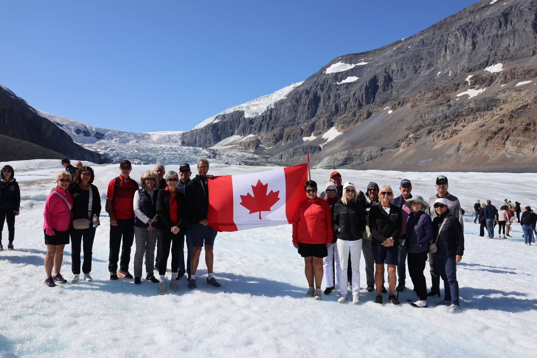 A Voyages.golf tour group on the Athabasca Glacier in the Canadian Rockies