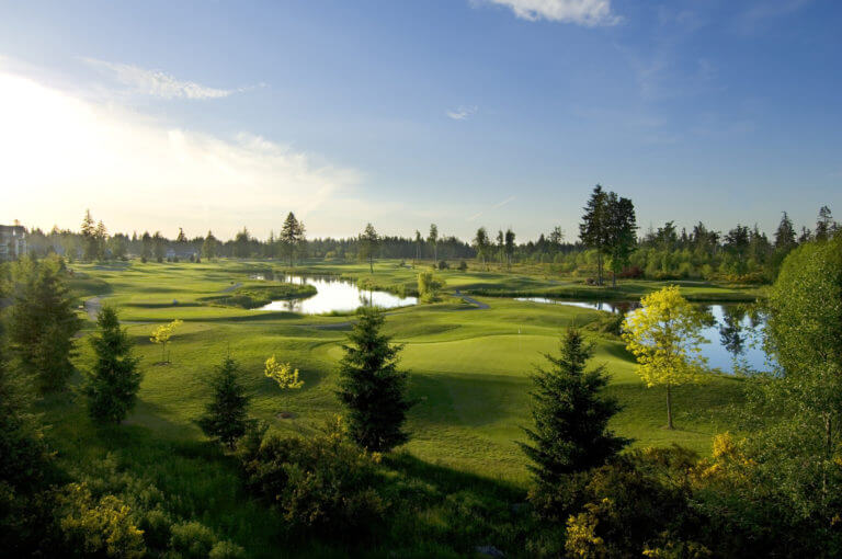 Overlooking the third and fourth holes with large lake at Crown Isle Golf Resort