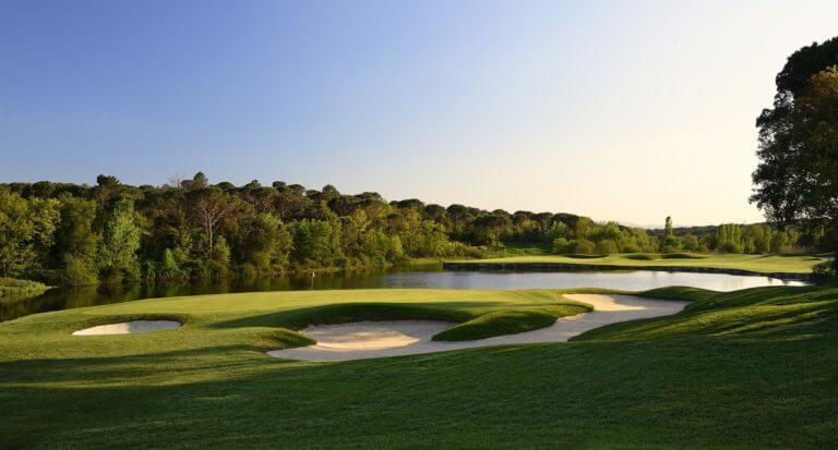 The large eleventh green is flanked on one side by a lake and bunkers on the other
