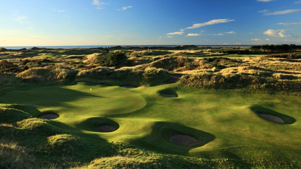 Overlooking the second green flanked by pot bunkers and undulating hills