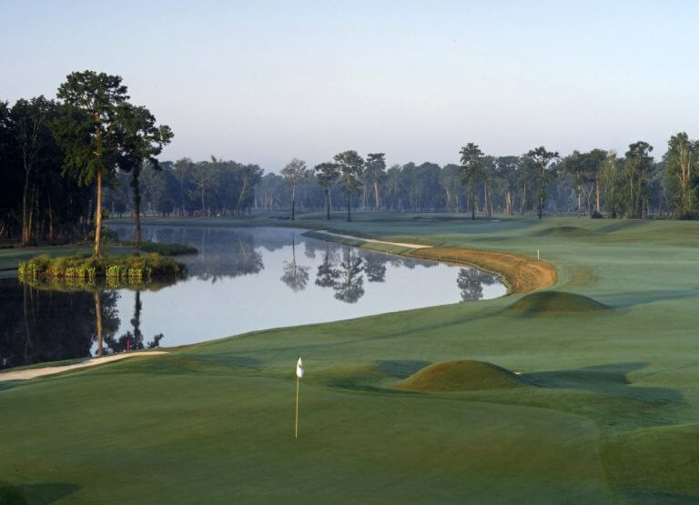 Dusk settles over a lake next to the eighteenth hole