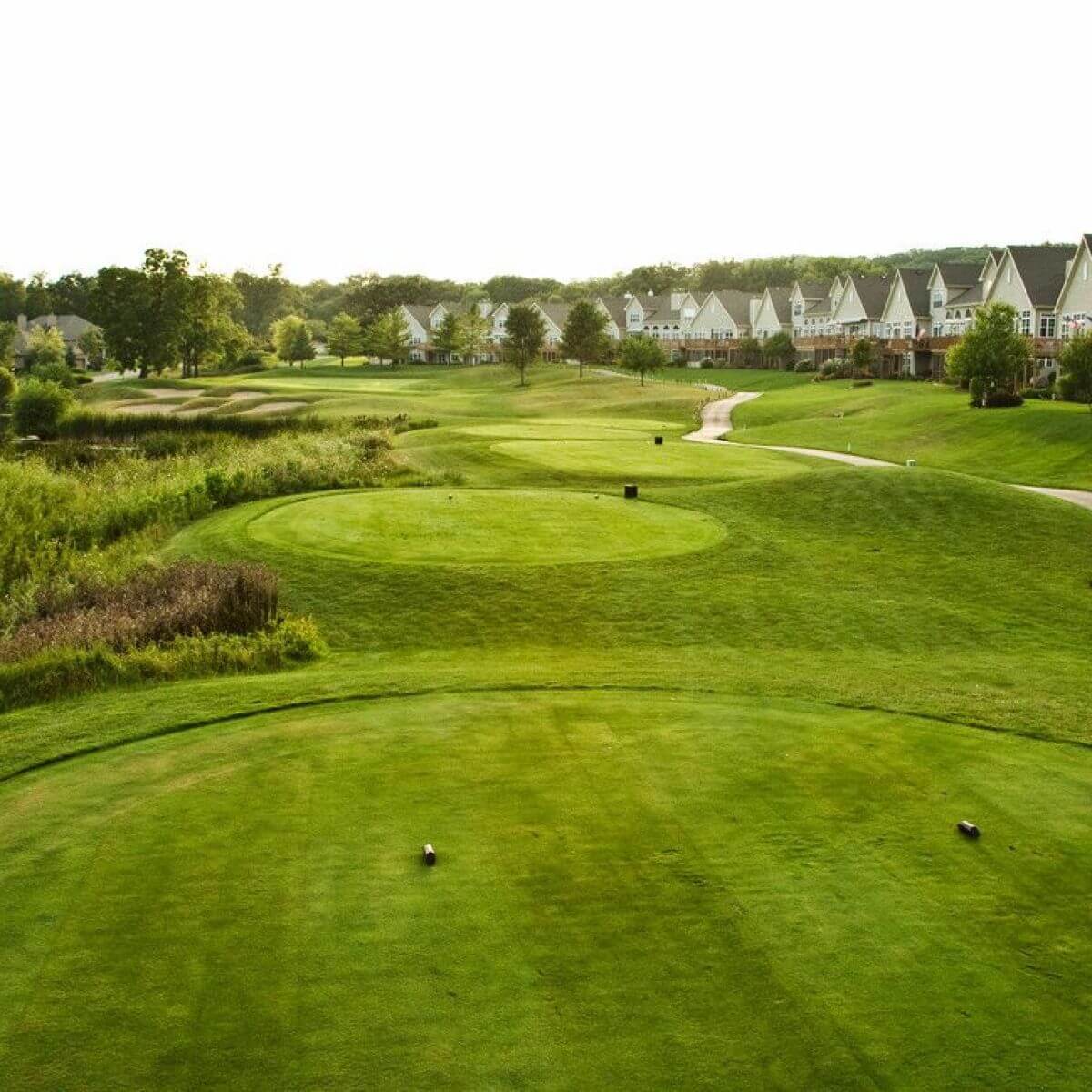 Resort accommodation lines the Player course fairways